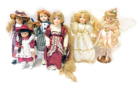 A group of porcelain headed collectors dolls, comprising Alberon Stephanie, Fairytale Collection Rapunzel, Princess Collection Emma, Alberon Angel, Leonardo Collection Fairy Queen, and another unboxed. (6)