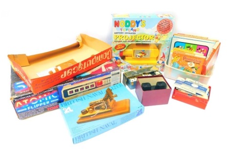 Various toys and games, comprising Atomic Pinball by Tomy, Noddy's Toy Land projector, View Master and stereo cards, dominoes, Disney Illuminated Home Movies. (a quantity)