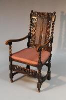 A reproduction Carolean Bergere backed armchair.