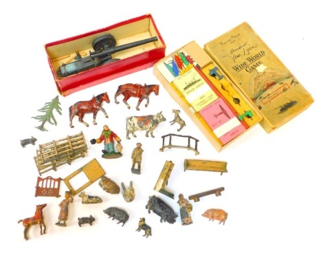 Britain's lead figures, playworn, animals, fences, etc., a Britain's number 4-7 naval gun, boxed, and a Wild World game. (1 box)