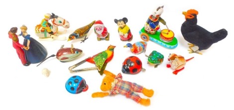 A collection of Japanese and Chinese clockwork toys, comprising duck, mouse, Santa Claus, Mickey Mouse, Prince and Princess, jumping frog, ladybird, etc. (1 tray)