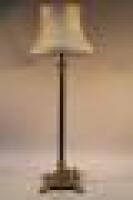 A modern reproduction columnar electric standard lamp