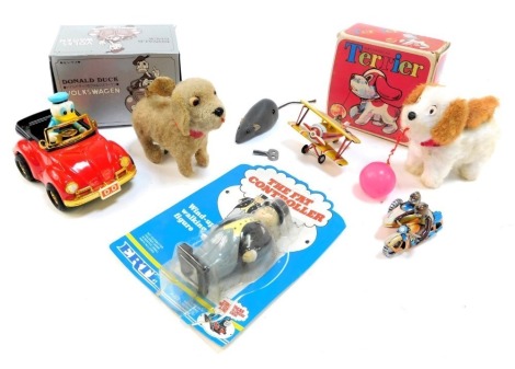 Various clockwork and tinplate toys, to include Donald Duck VW, aeroplane, ERTL station controller from Thomas The Tank Engine, Sport Motorbike and side arm, mechanical terrier, and further mechanical dog. (1 tray)