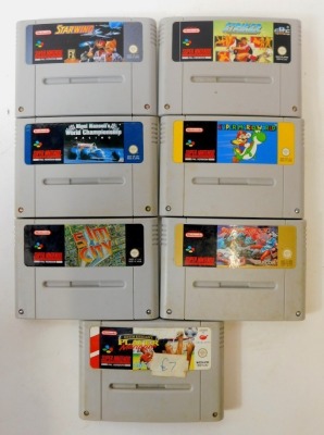 A Nintendo Super Nintendo Entertainment System, with games and controllers, to include Street Fighter 2, Super Mario World, Nigel Mansell's World Championship, Sim City, Star Wing, Kevin Keegan's Player Manager, etc. (1 box) - 2