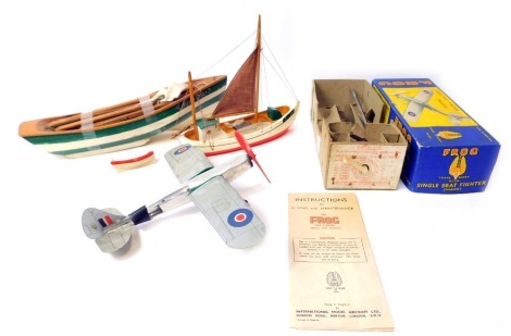 A Frog single seat fighter Mk V, boxed, and two pond yachts. (3)