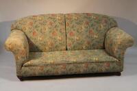 An early 20thC upholstered two seater sofa