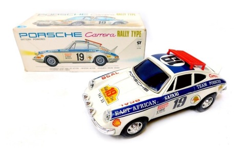 An Alps battery powered Porsche Carrera rally type car, boxed.