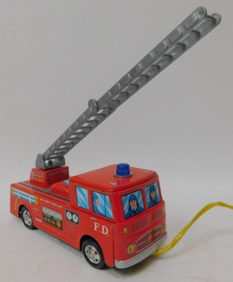 An Asahi battery operated remote control tinplate ladder fire engine, with top light and siren, and a Yone battery operated remote controlled Porsche, boxed. (2) - 2