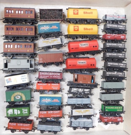 Hornby, Dapol, Bachman and other OO Gauge rolling stock, including brake vans, Lyle's Golden Syrup box van, Texaco tanker, Bird's Eye Fish Fingers box van, Derbyshire Stone Limited five plank vans, etc. (1 tray)