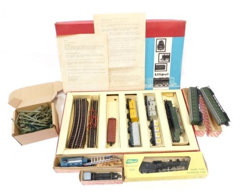 A Liliput HO Gauge train set, including OBB articulated crocodile electric locomotive, rolling stock including Jamaica Banana box car, track, other boxed rolling stock including break down crane, a Liliput model barn HO gauge 107 Express Train Locomotive