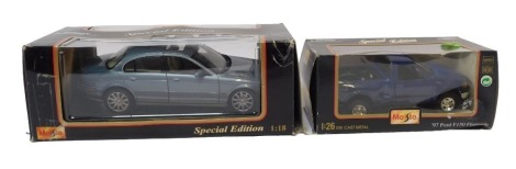 Maisto 1:18 and 1:26 scale diecast vehicles, comprising 97 Ford F150 flare side, and a Jaguar S type 1999, boxed. (2)