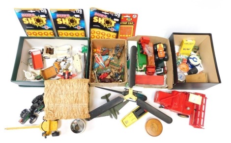 Diecast playworn vehicles, comprising a Heli 1 remote control helicopter, an MF Britain's Massey Ferguson combine harvester, tinplate windup mouse, miniature doll's part tea set, tractors, Matchbox trucks, etc. (2 boxes)