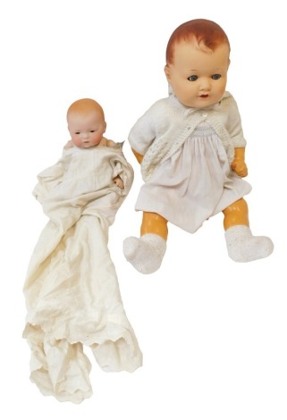 Two bisque headed dolls, comprising a German Armand Marseille child, numbered 341-4K, with painted body, and fixed blue eyes, and a later example. (2)