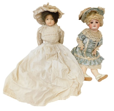 A 19thC continental porcelain headed doll, unmarked, with fixed painted eyes and teeth, in lace gown, 40cm high, and a SPBJ of Paris bisque headed doll numbered 2, in blue floral dress, with articulated papier mache limbs, 38cm high. (2)