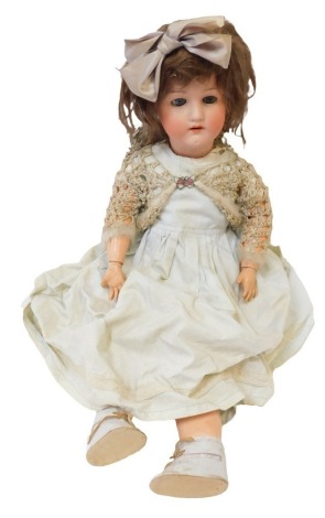 A Heubach Koppelsdorf German bisque headed doll, with fixed blue eyes and open mouth, with articulated limbs, numbered 250.6, stamped Germany, 65cm high.