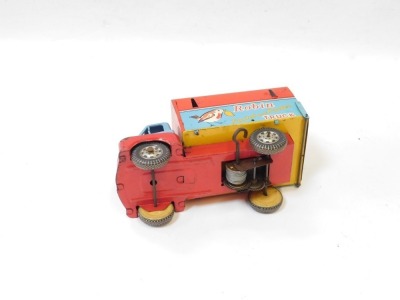 A Japanese tinplate clockwork truck, in blue and red, with Robin paint and poster advertising. - 2