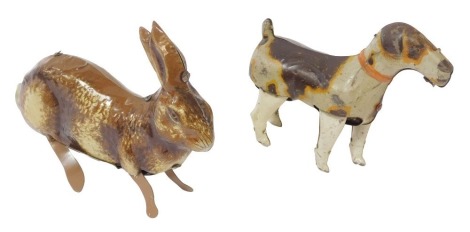 Two tinplate clockwork animals, comprising a British made hopping hare, and a German DRSM dog, lacking keys. (2)