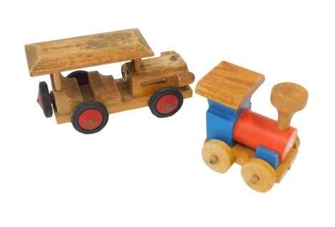 Wooden toys, comprising model of an early 20thC motor car, with tyres marked HEROS, 21cm long, together with later wooden train. (2)