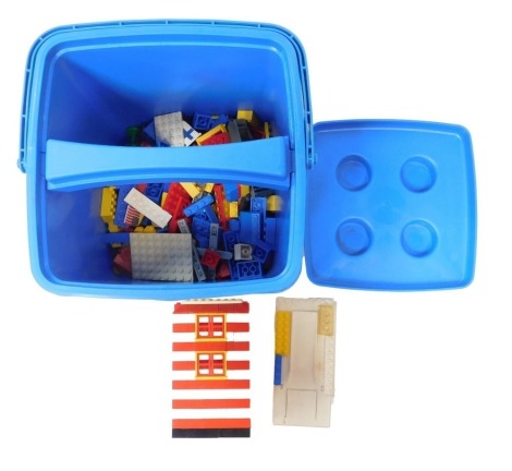 A Lego Systems blue storage tub and small quantity of Lego.