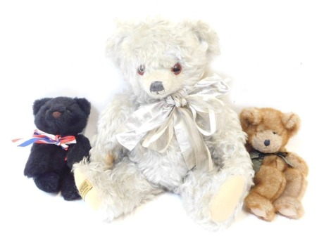 A Merry Thought silver bear, a Merry Thought soft toy black bear, and a Boyd's Collection brown Teddy bear. (3)