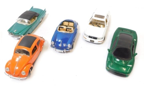 Five diecast vehicles, comprising a Burago Porche 356B 1961 1-18 scale, a Majorette Coccinelle VW 1-17 scale, a Solido Cadilac Eldorado 1955, 1-18 scale green sports car kit build, and a Lexus LS400. (5)