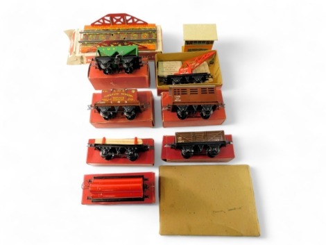 Hornby trains and Mettoy O gauge rolling stock and accessories, including Mettoy railway bridge, Hornby trains hopper wagon, number 1 cattle truck, gas cylinder wagon, flat truck, etc., boxed and unboxed. (1 tray)