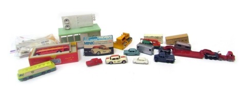 A group of diecast vehicles and accessories, playworn, to include a Minic E Type Jaguar, boxed, Tri-ang Minic Motorways London Transport bus, boxed, a Tri-and Minic starting gate, and various Dinky and Corgi playworn HO gauge railway vehicles. (1 tray)