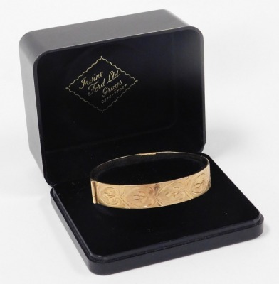 A 9ct gold bangle, with engraved repeating acanthus leaf decoration, on a snap clasp, 24.5g. - 3