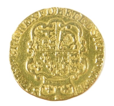 A George II gold guinea 1781, the obverse with laureate head, reversed with crowned shield of arms, approximately 8.2g.