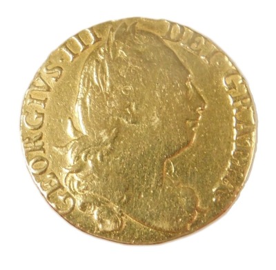 A George II gold guinea 1781, the obverse with laureate head, reversed with crowned shield of arms, approximately 8.2g. - 2