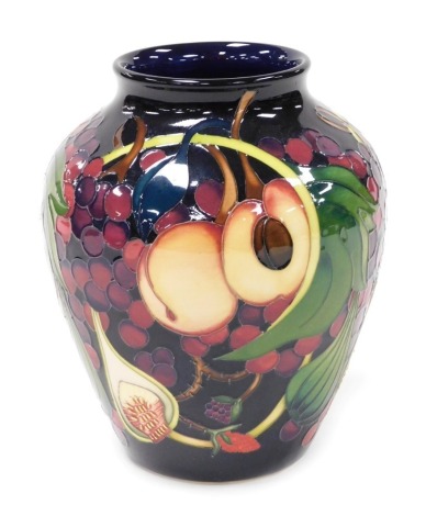 A Moorcroft pottery Queen's Choice pattern vase, of shouldered tapering form, decorated Kerri, 2000, painted and impress marks, 21cm high.