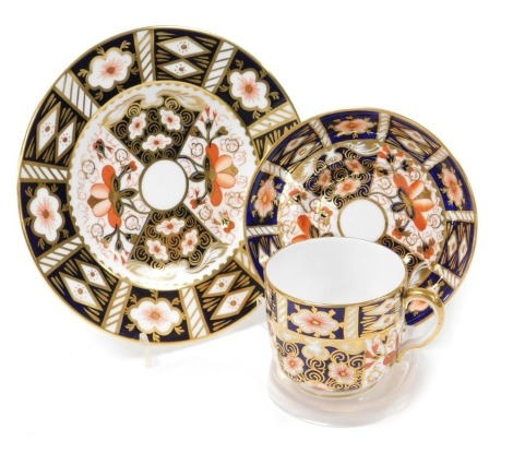 A Royal Crown Derby Imari porcelain trio, pattern number 2451, printed marks, comprising cup, saucer and tea plate.