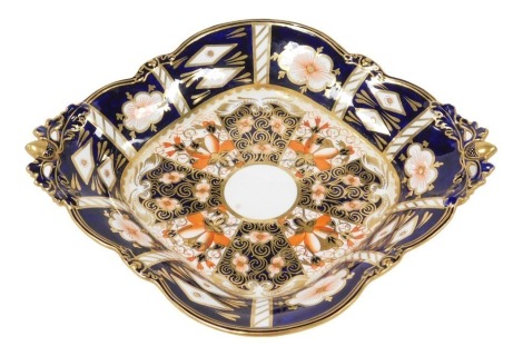 A Royal Crown Derby porcelain Imari pattern dessert dish, circa 1904, with twin acorn and oak leaf handles, raised on four similar feet, printed marks, 29cm wide.