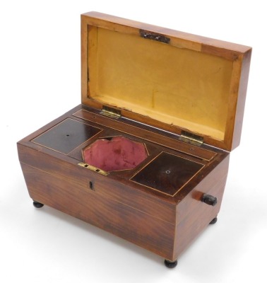 A Regency mahogany and rosewood tea caddy, with boxwood line inlay of sarcophagus form, with twin ring handle, the hinged lid opening to reveal two compartments flanking a recess for a mixing bowl, raised on turned feet, 34.5cm wide. (AF) - 2