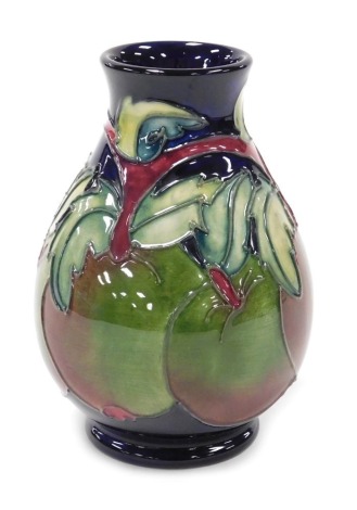 A Moorcroft pottery Apples pattern vase, of baluster form, decorators initials CB, painted and impressed marks, 13.5cm high.