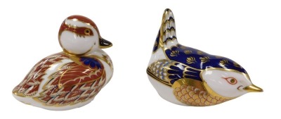 A Royal Crown Derby Imari paperweight, modelled as a swimming duckling, gold button and another modelled as a wren. (2)