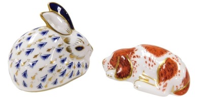 A Royal Crown Derby Imari porcelain paperweight, modelled as a puppy, circa 2000, an exclusive for the Royal Crown Derby collector's guild, gold button, together with a further Royal Crown Derby Imari paperweight modelled as a rabbit. (2)