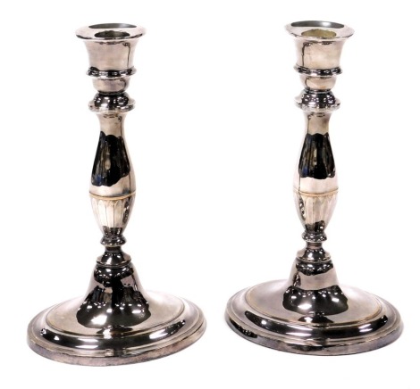 A pair of Regeny Old Sheffield Plate candlesticks, of baluster form, raised on an oval base, 24cm high.