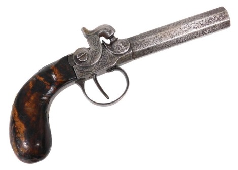 A 19thC side lock percussion cap pocket pistol, with an 8cm long octagonal barrel and walnut grip, 18cm long.