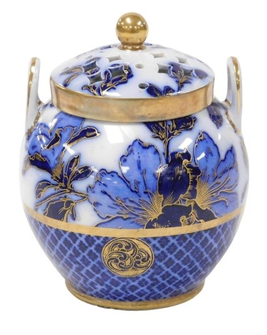 A late 19thC Wedgwood pottery twin handled pot pourri vase and cover, decorated in blue and white with flowers, gilt heighted, impressed and painted marks, 15cm high.