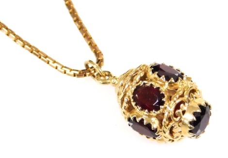 A 9ct gold and garnet pendant, of Turkish lantern form, on a 9ct gold box link neck chain, with bolt ring clasp, 12.7g.