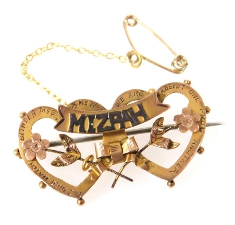 A 9ct gold Mizpah brooch, with a scrolling titled banner fronting a pair of conjoined hearts, and flowers, and engraved script, 2.3g.