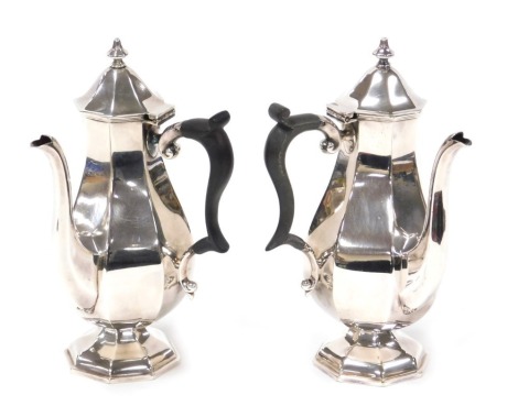 A pair of silver plated coffee pots, of octagonal baluster form, by Edward and Sons of Glasgow, 20cm high.