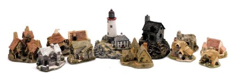 A group of Lilliput Lane and Danbury Mint sculptures, including Green Dragon Pub, The Vicarage, Applejack Cottage, Inglewood, Preston Mill, and Penmullion Lighthouse. (qty)