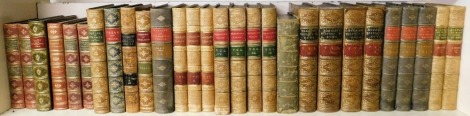 Bindings. Macaulay's Essays three vols, Goldsmith's Works four vols, Mommsen's History of Rome four vols, and further calf and Morocco bound books. (1 shelf)