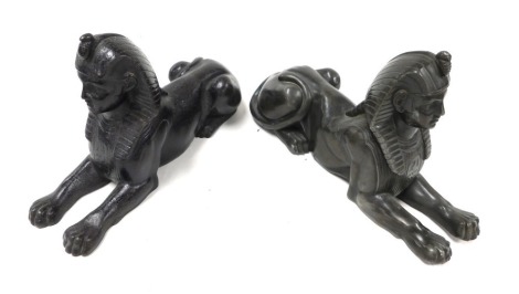 A Victorian cast iron paperweight, or doorstop, modelled as a recumbent sphinx, 25cm wide and a further cast metal figure of a recumbent sphinx 25cm wide. (2)