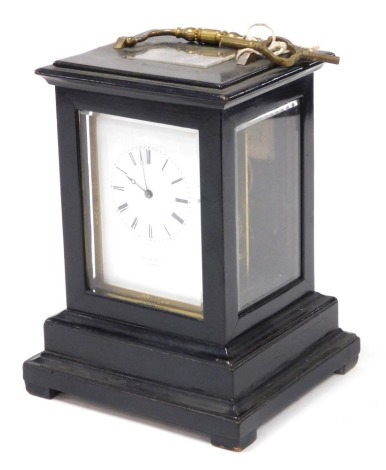 A late 19thC French ebonised striking carriage clock, by Henrymarc a Paris, rectangular enamel dial bearing Roman numerals, twin barrel movement with bell strike, the case of conventional form, with interior label to the back for T Cox Savory & Company, i