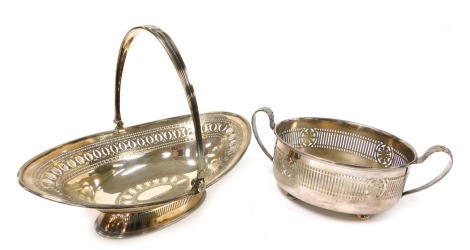 An Adam style silver plated oval basket, with pierced and engraved decoration, and swing handle with oval reserve, crest engraved, 31cm wide together with a silver plated 2¼ pint twin handle dish frame, 28cm wide. (2)