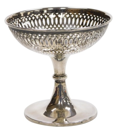 A George V loaded silver pedestal sweet meat dish, with pierced decoration, Chester 1911, 12cm high, 5.70oz all in.