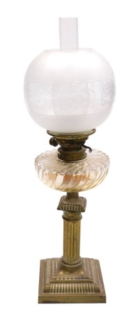 An early 20thC Messenger's number one brass oil lamp, of column form, with a fluted pressed glass reservoir, with chimney and frosted and etched globular shade, 66.5cm high.